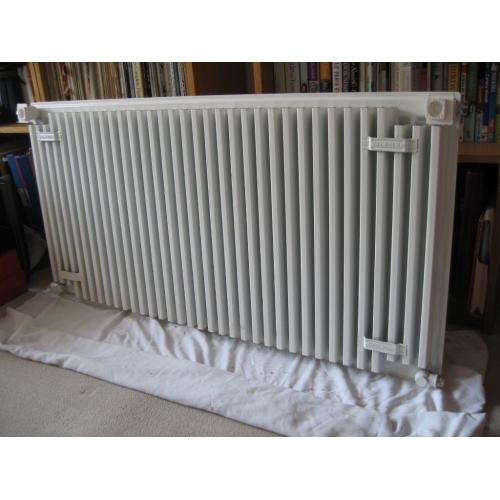 White radiator with grille cover