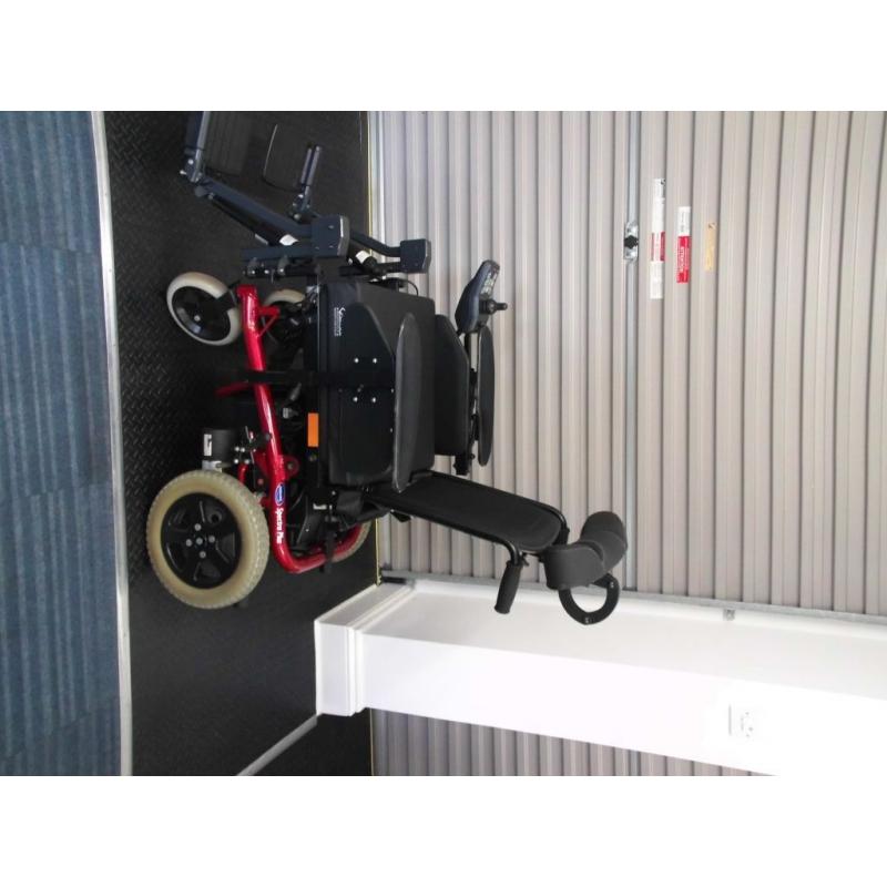 Invacare Spectra Plus electric wheelchair with rising tilt in space seat electric leg lifts etc