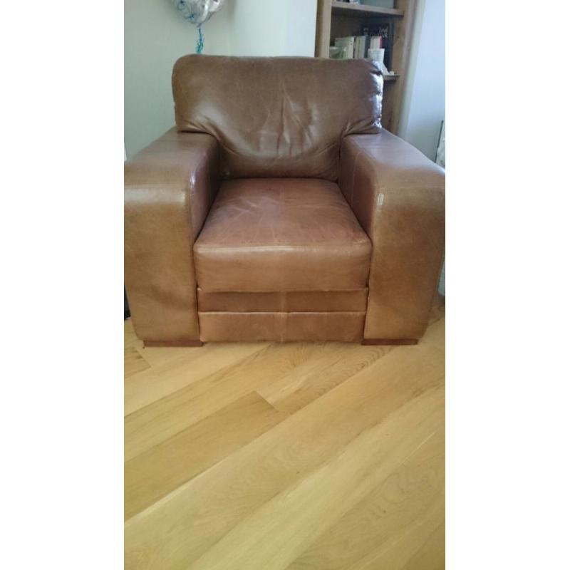 Real Italian leather sofa, armchair and footrest. Excellent condition.