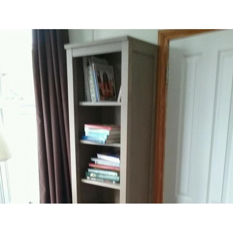 Long slim grey bookshelf