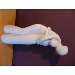 A lovely stone carved ornament of a Mother holding a child