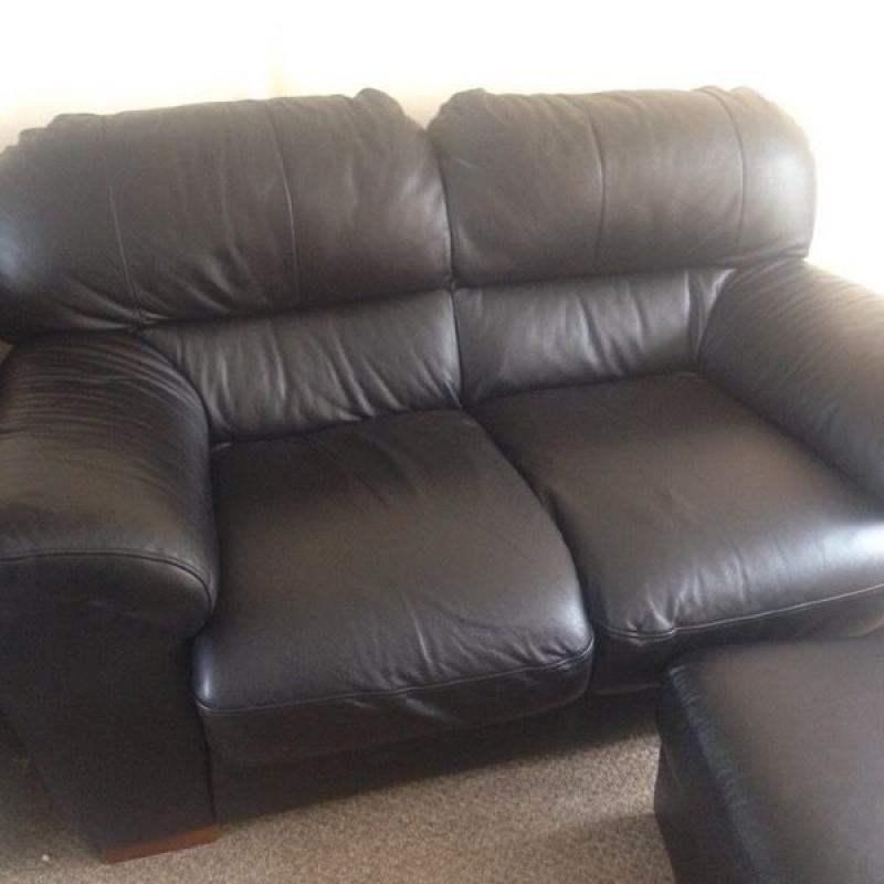 Faux leather sofa and foot stall