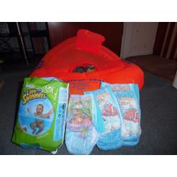 Zoggs swimming trainer seat 12-18 months with 20 swim nappies