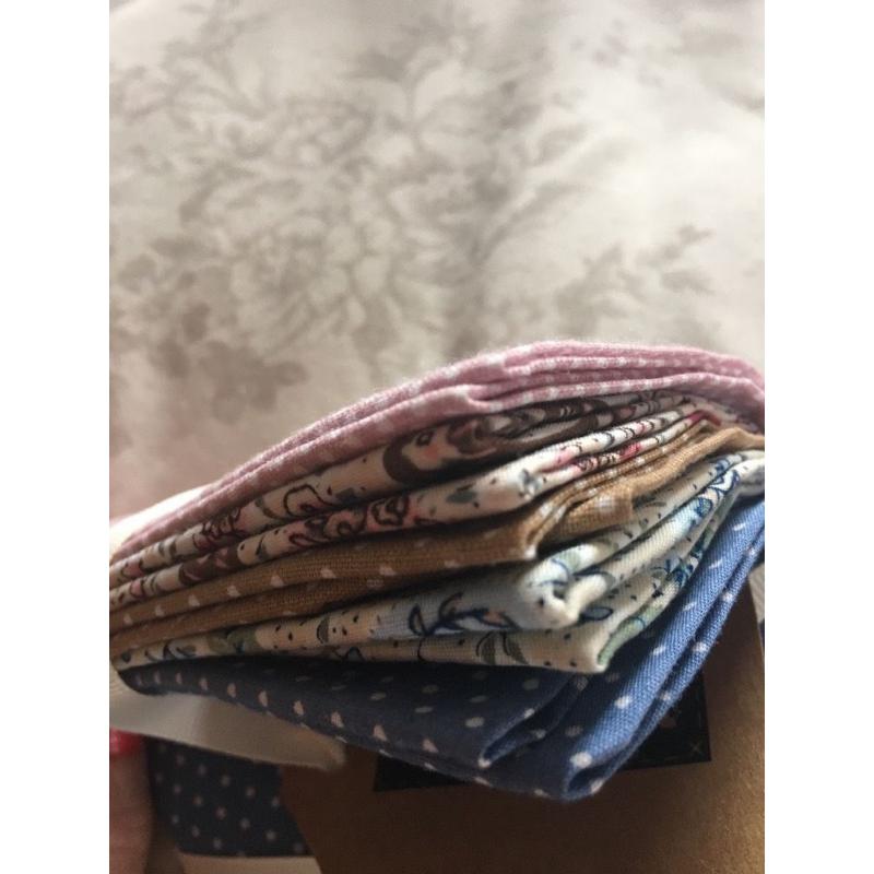 Small squares of material to make bunting