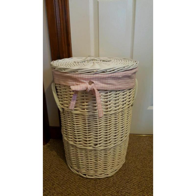 Pink and white laundry basket