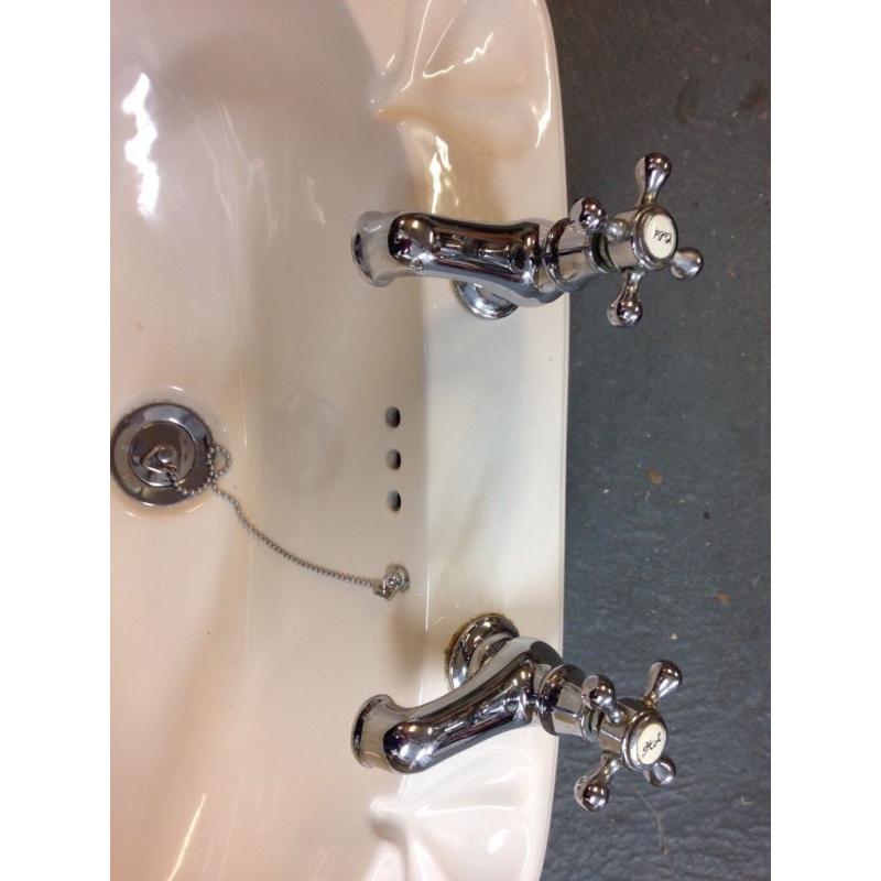 Bathroom sink with taps