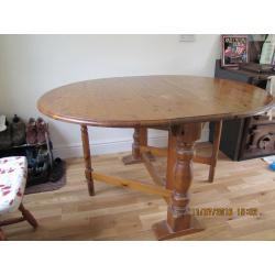 Oval drop leaf dining table plus 4 chairs