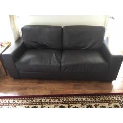 X2 leather style choc sofas one v.good condition one with defects