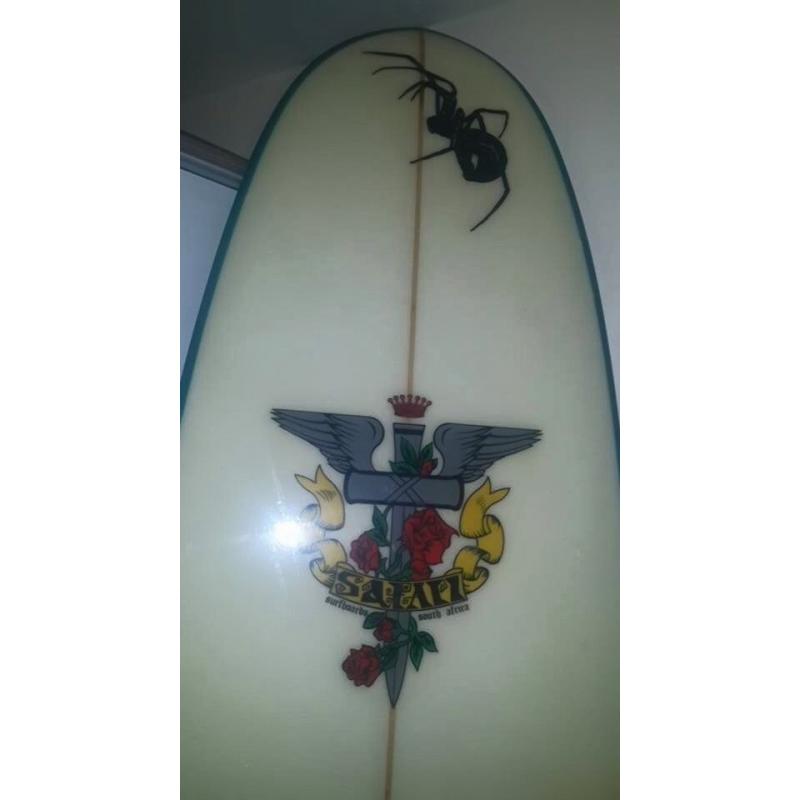 Safari Spider Surfboard 7'6" with a leash