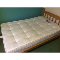 Small Double (three quarter) wooden bed stead and Sleepmasters firm mattress.