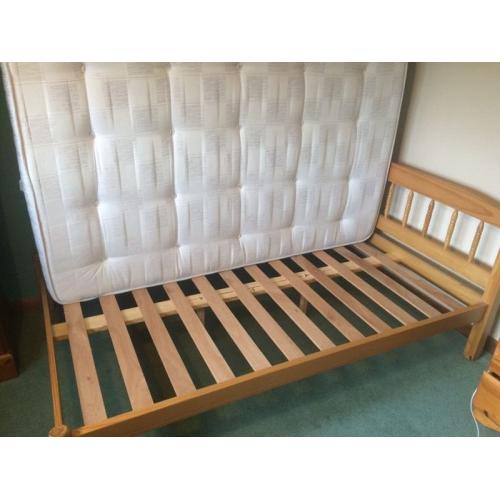 Small Double (three quarter) wooden bed stead and Sleepmasters firm mattress.