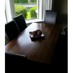 Solid wood dining table and six leather chairs
