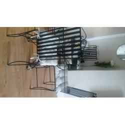Solid wrought iron dinning table with 4 high back solid chairs,