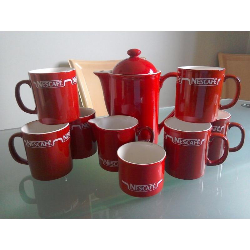 Nescafe coffee pot, sugar, cream and mugs