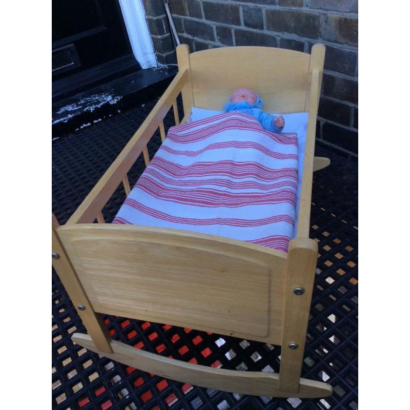 Wooden toy rocking crib