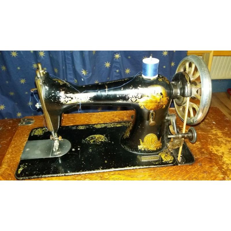 antique singer sewing machine with original cabinet