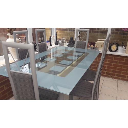 Glass table and six chairs in excellent condition buyer collects