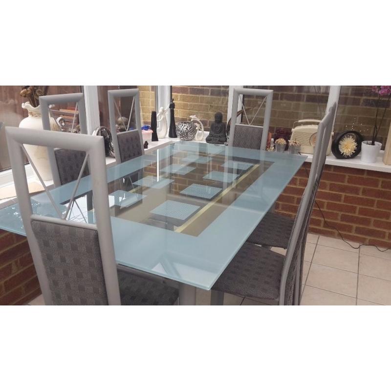 Glass table and six chairs in excellent condition buyer collects