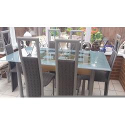 Glass table and six chairs in excellent condition buyer collects