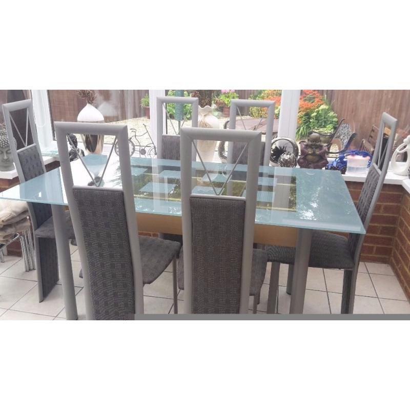 Glass table and six chairs in excellent condition buyer collects