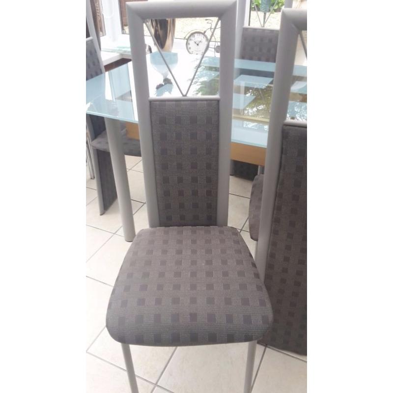 Glass table and six chairs in excellent condition buyer collects