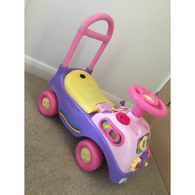 Pink sit on and push along car