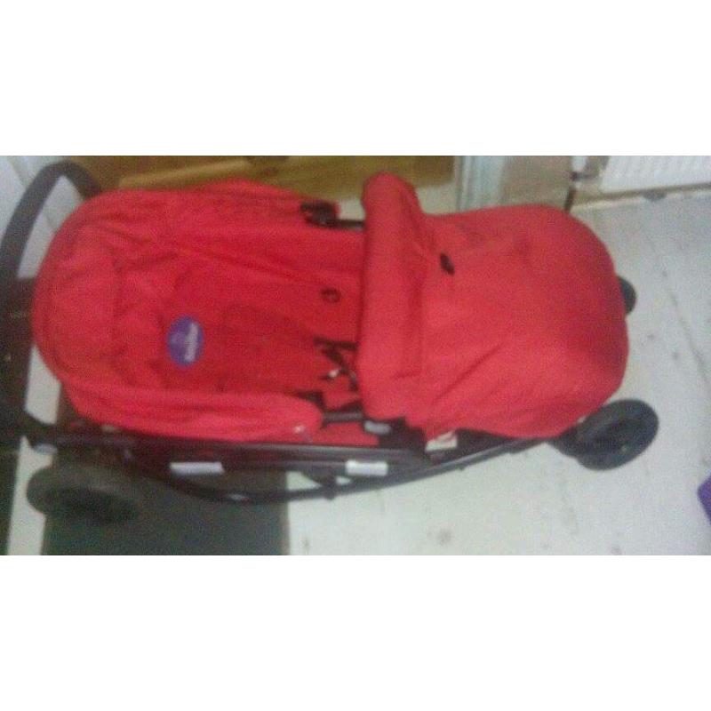 Red pushchair suitable from birth