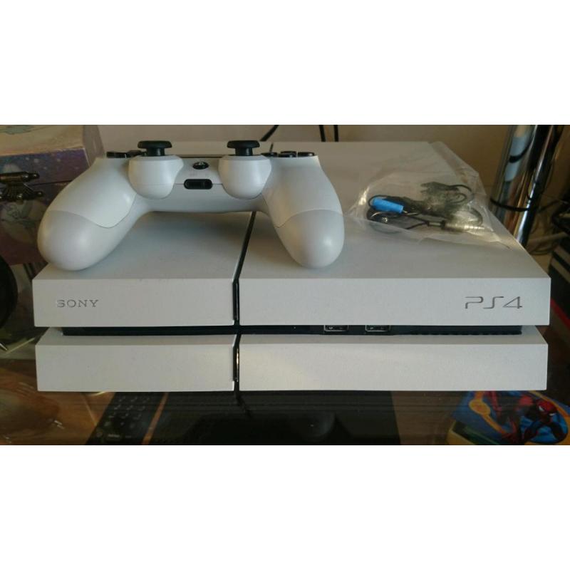 White PS4 with controller and 4 games