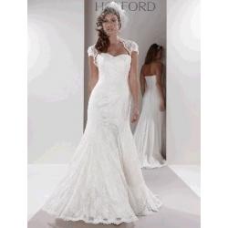 Beautiful Sassi Holford Serena lace wedding dress with shrug and veil