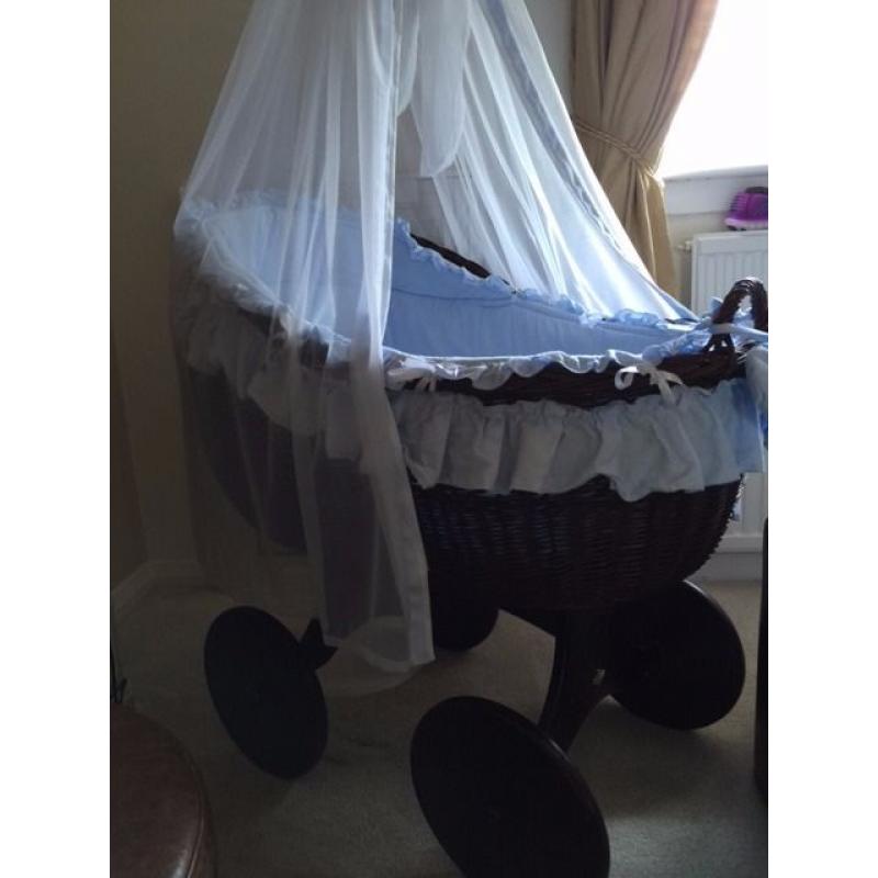 Beautiful brown wicker crib on wheels