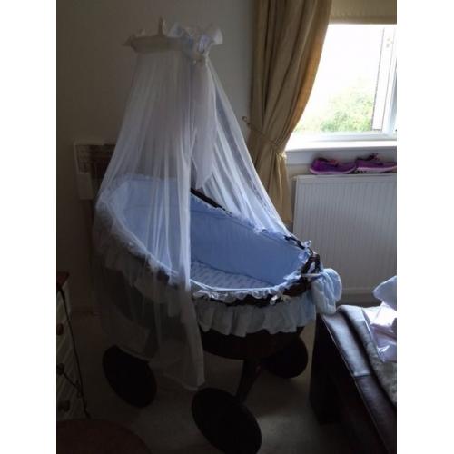 Beautiful brown wicker crib on wheels