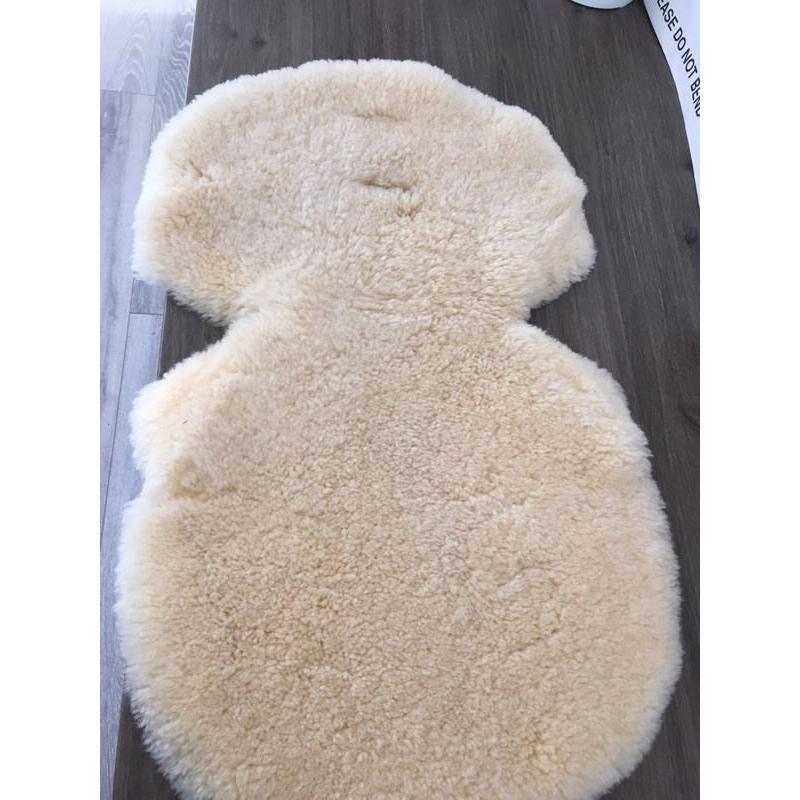 Lambswool liner for pushchair.
