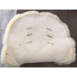 Lambswool liner for pushchair.