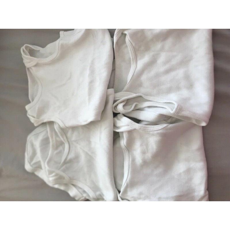 4 white sleeveless baby vest