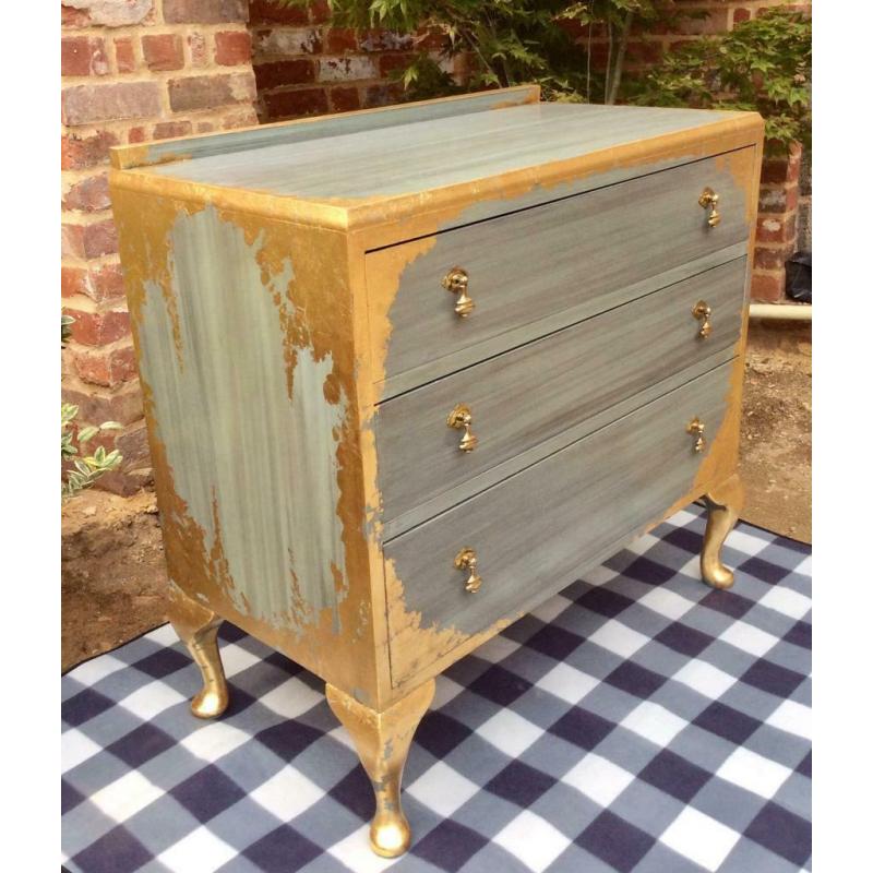 Solid wood French style chest of drawers with golden leaf and brass tear drop handles