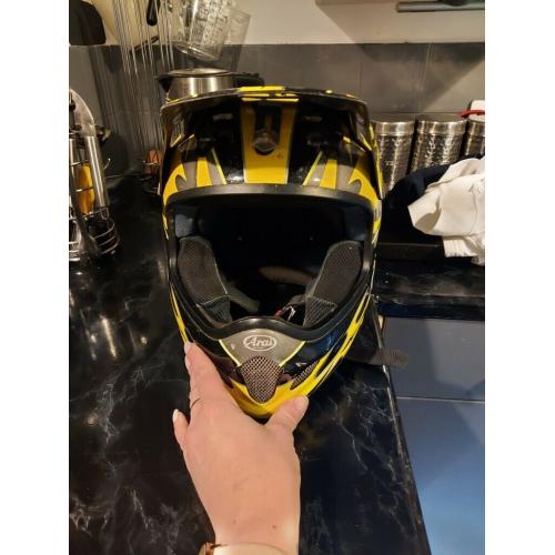 Arai black and yellow helmet