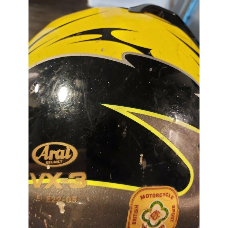 Arai black and yellow helmet