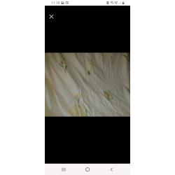 Long cream curtains with floral pattern