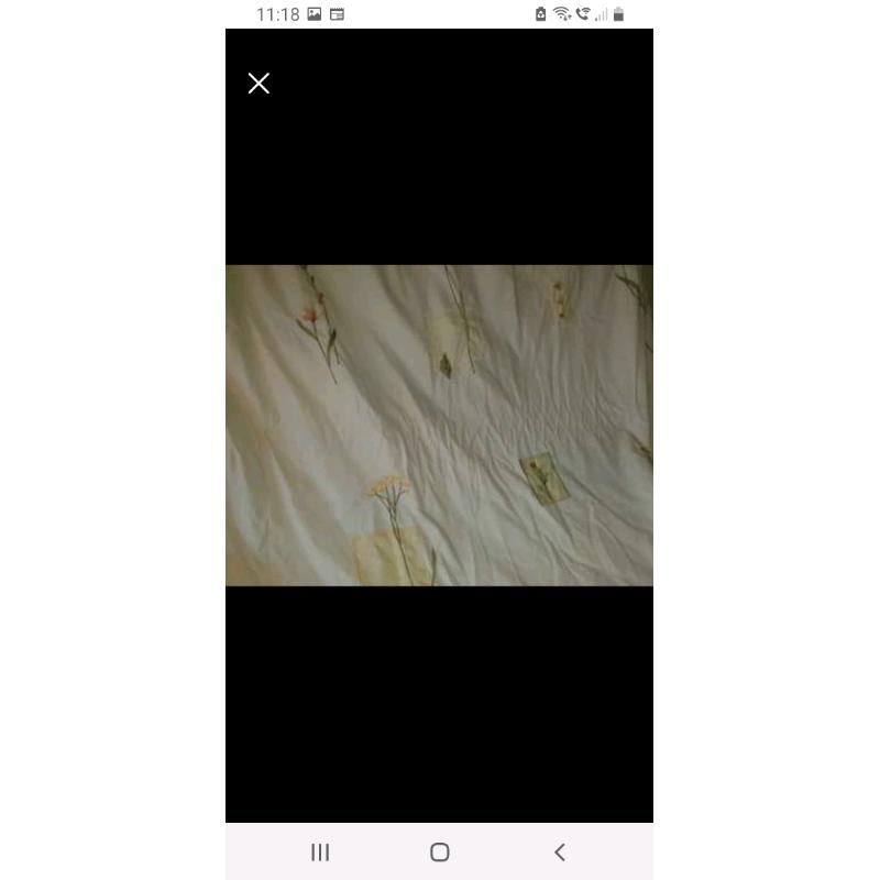 Long cream curtains with floral pattern