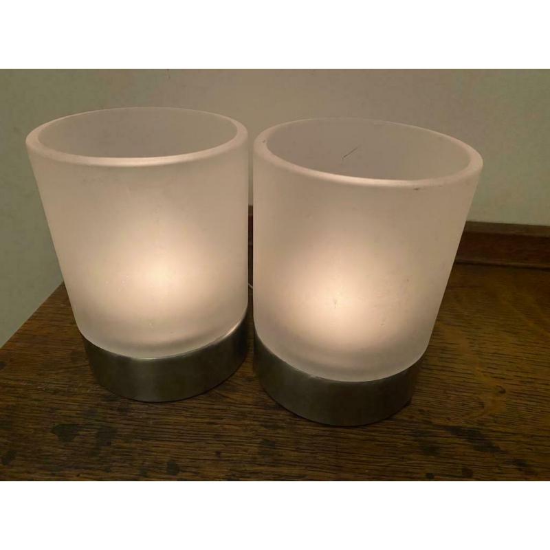 2 glass and stainless steel tealights.