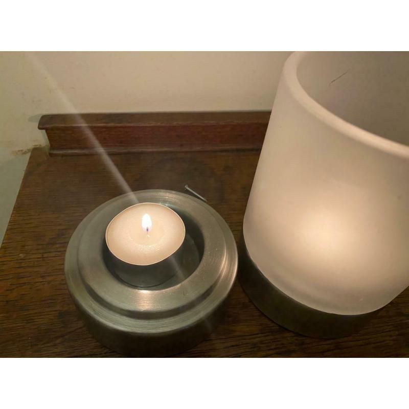 2 glass and stainless steel tealights.