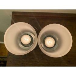 2 glass and stainless steel tealights.