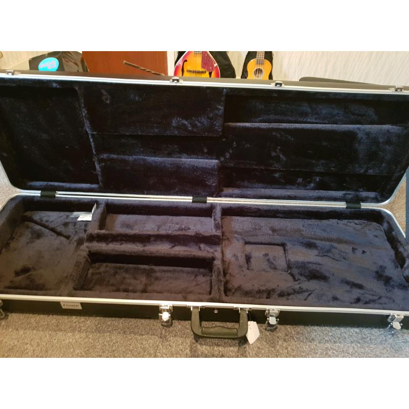 Deluxe lockable hard shell Guitar case with plush velvet lining.