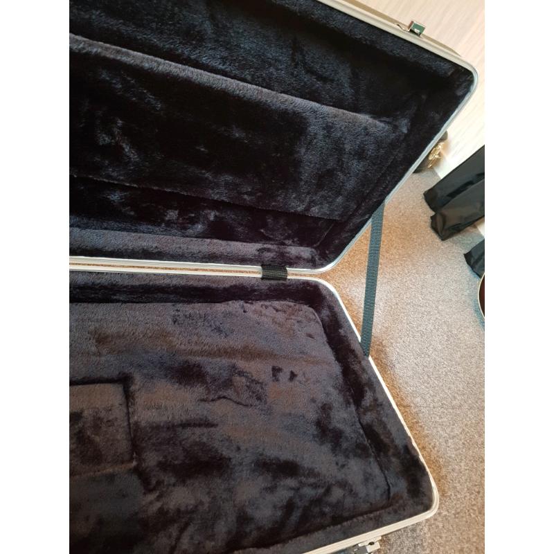 Deluxe lockable hard shell Guitar case with plush velvet lining.