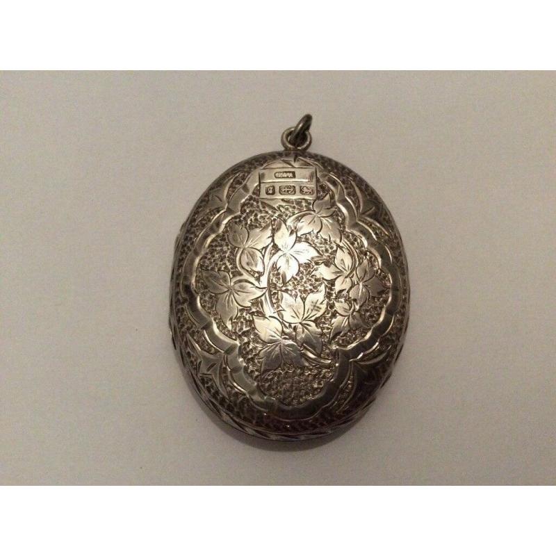 ABSOLUTE GEM; very fine and exquisite large antique silver locket marked Birmingham, circa 1881.