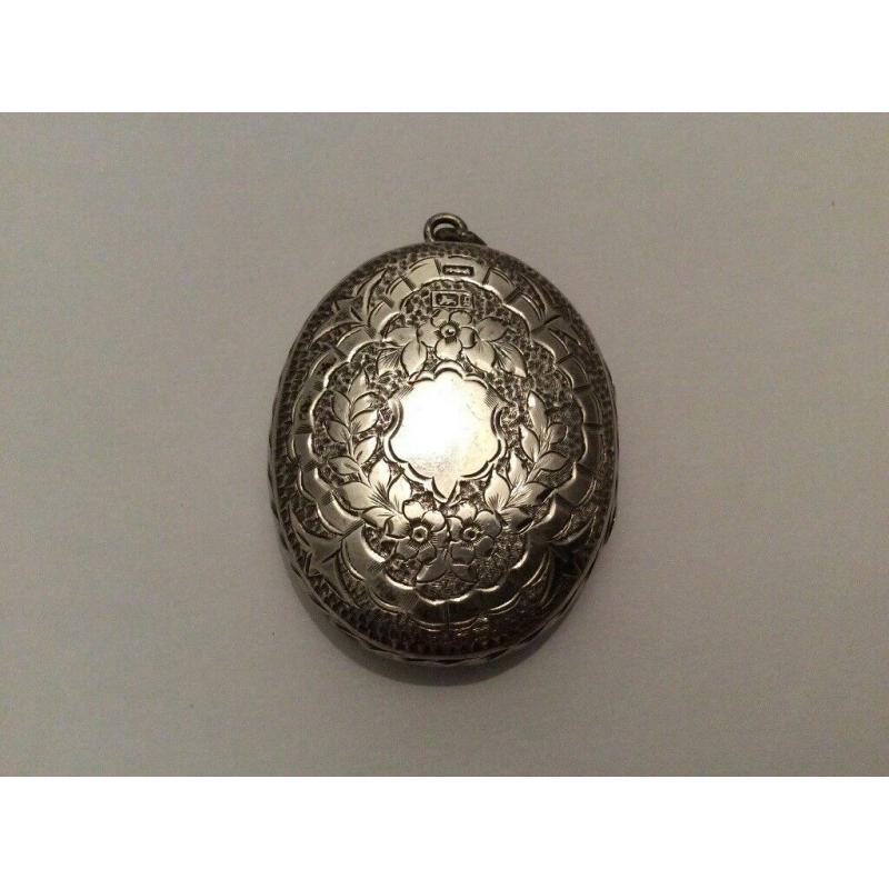 ABSOLUTE GEM; very fine and exquisite large antique silver locket marked Birmingham, circa 1881.