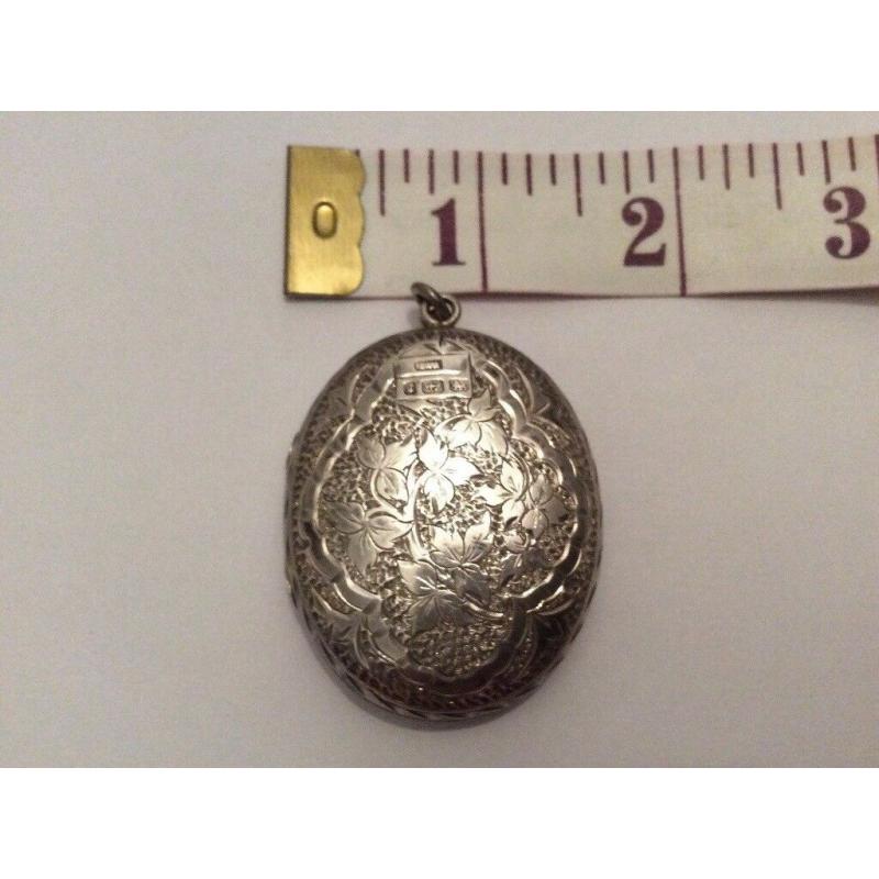 ABSOLUTE GEM; very fine and exquisite large antique silver locket marked Birmingham, circa 1881.