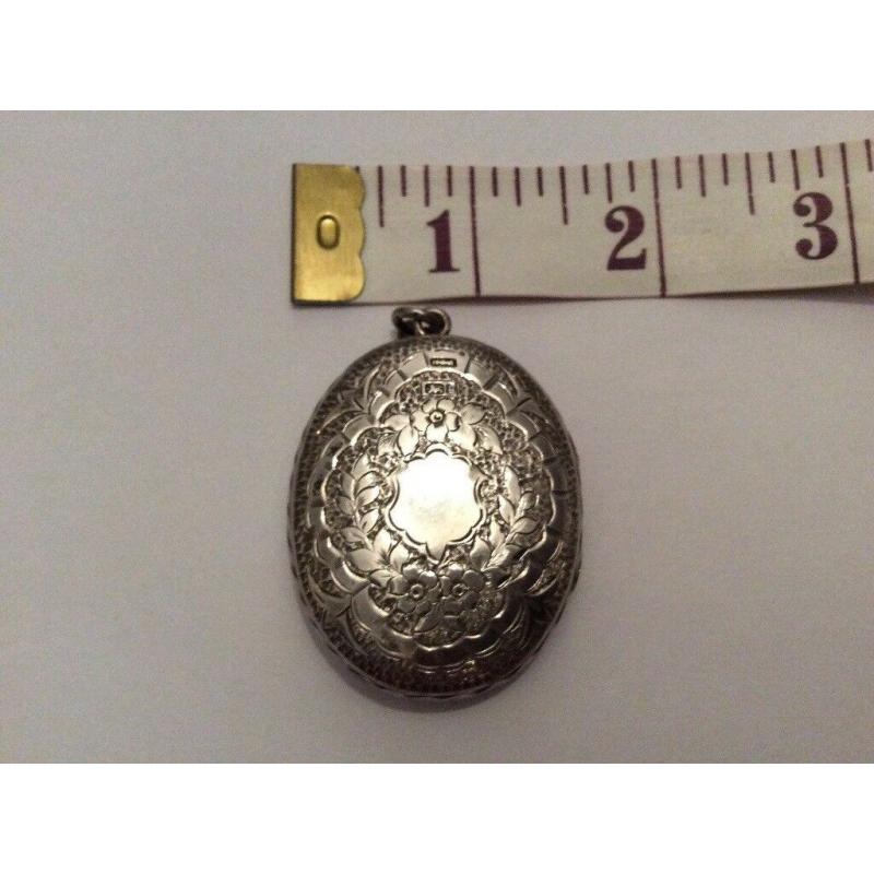 ABSOLUTE GEM; very fine and exquisite large antique silver locket marked Birmingham, circa 1881.